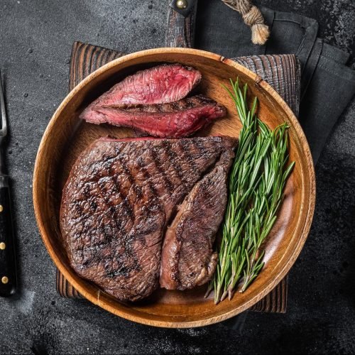 bbq-grilled-medium-rare-top-sirloin-beef-steak-rump-steak-in-a-wooden-plate--e1664111691605.jpg